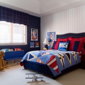 Dark blue wall in a schoolboy's bedroom