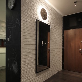 Black wall in the entrance area of ​​the entrance hall
