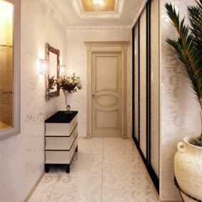 Long corridor with a mirror and a pedestal