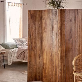 Wooden screen in the bedroom of a private house