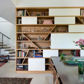 Open shelves in the wall of laminated particleboard