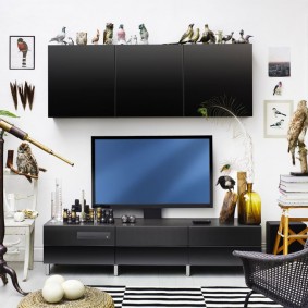 Large hanging cabinet over the TV in the living room
