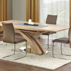 Dining table on a light rug in the living room