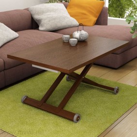 Coffee table on a green rug