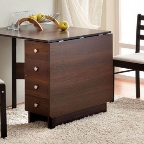 Compact table with convenient drawers
