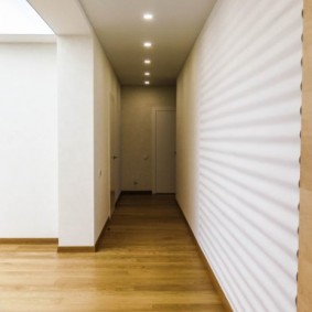 3D white panels in a narrow hallway