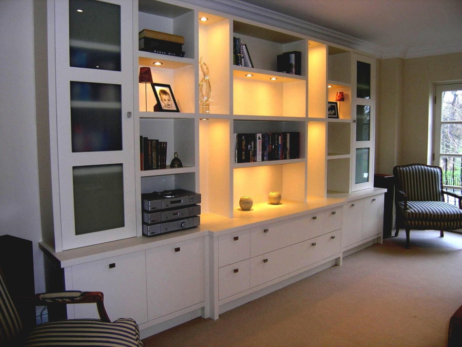 Illumination of open shelves in the wall for the living room